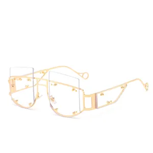 Fashion rimless sunglasses with gold hollow geometric metal frames and rivet details