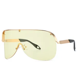 Lunettes de soleil oversize tendance avec verres jaune clair et monture en métal doré