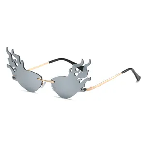 Futuristic flame shaped rimless sunglasses with gold metal frame and grey tinted lenses