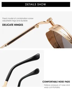 Detail of vintage round metal sunglasses with ornate carvings and durable screw hinges