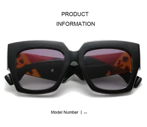 Detailed view of square sunglasses showing tortoise shell pattern on inner temples