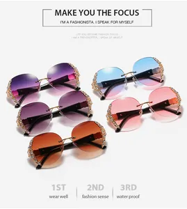 Close-up of luxury oversized rimless sunglasses in multiple gradient colors with rhinestone detail