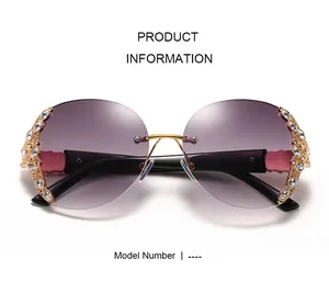 Detail view of oversized rimless purple sunglasses with rhinestone-encrusted gold metal frames