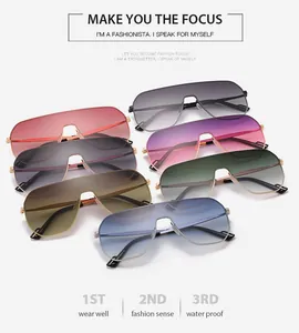 Detail view of seven colorful gradient frameless sunglasses arranged in a fan shape