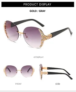 Detail view of oversized rimless sunglasses featuring floral rhinestone accents and gradient lenses