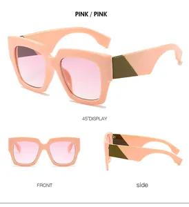 Pink oversized square sunglasses with gradient lenses and green geometric temple detail