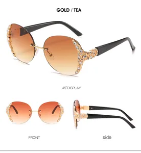 Detailed views of vintage oversized rimless sunglasses with gold accents and rhinestones