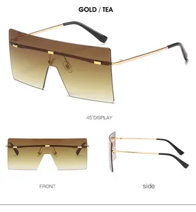 Trois vues de lunettes de soleil sans monture surdimensionnées or et thé dégradé