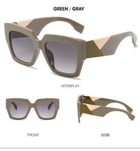 Detail view of large square sunglasses with unique green and gray geometric temples