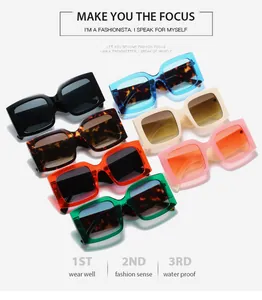 Flat lay of square sunglasses in various colors including leopard print and bright neons