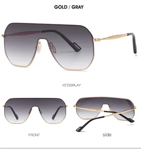 Detail view of retro gold shield sunglasses with gradient gray lenses and metal frame