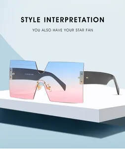 Detail of square oversized gradient lenses with stylish black temples and gold accents