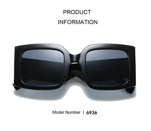 Detail view of model 6936 square black sunglasses with polished thick frame and dark lenses