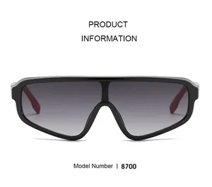 Gros plan des lunettes de soleil 8700 avec monture noire et détails de branches rouges