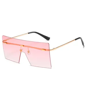 Lunettes de soleil sans monture surdimensionnées avec verres roses dégradés et branches dorées