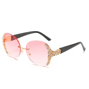 Retro oversized round rimless sunglasses with pink gradient lenses and diamond accents