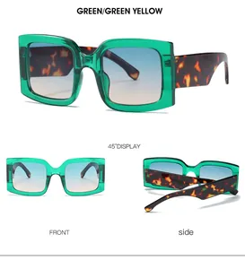 Detail view of square sunglasses with green frames and tortoiseshell temples