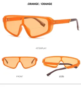 Vues détaillées des lunettes de soleil orange surdimensionnées avec accents dorés