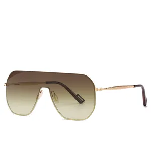 Frameless oversized rimless sunglasses with brown gradient lenses and gold metal temples
