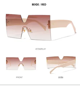 Detail view of large square oversized sunglasses with gradient beige and red lenses