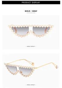 Detail of luxury cat-eye sunglasses with gold metal frame and sparkling rhinestones