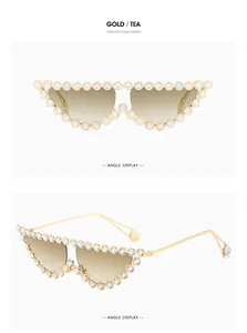 Detailed view of gold cat eye sunglasses with rhinestones and tea gradient lenses