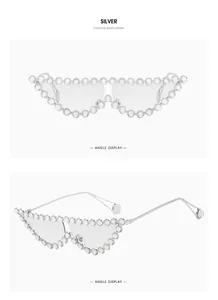 Detail of silver cat eye sunglasses featuring heavy rhinestone encrusted metal frames