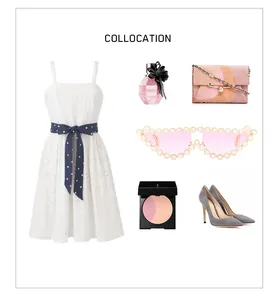 Cat eye sunglasses with pearl-encrusted frame styled with a chic white lace dress and accessories