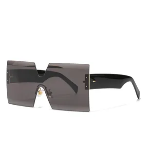 Modern oversized square sunglasses with flat top shield lens and side metal rivet accents