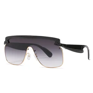 Futuristic oversize shield sunglasses with black frames and gradient lenses on white backdrop