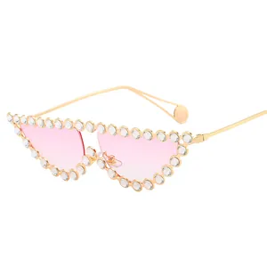 Fashion cat-eye sunglasses with pink gradient lenses and heavy rhinestone metal frame