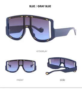 Three-way view of blue oversized rimless sunglasses with gold rivet decor and wide temples
