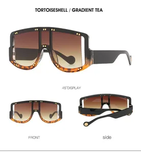 Oversized tortoiseshell sunglasses with gradient tea lenses and gold rivet detailing