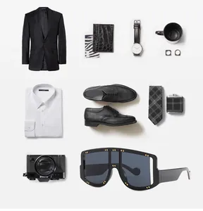 Flat lay of oversized black sunglasses with silver stud accents and luxury accessories