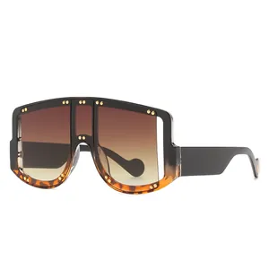 Oversize shield sunglasses with gold studs, black and tortoiseshell frame, gradient lenses