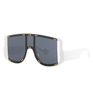 Fashionable oversized white sunglasses with grey shield lens and gold rivet accents