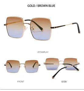 Détails de lunettes de soleil carrées rétro avec monture dorée et verres dégradés marron-bleu