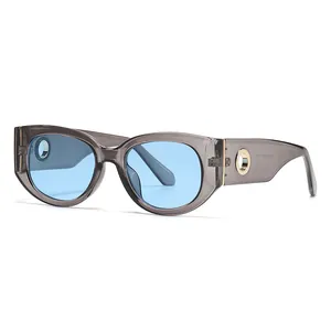 Fashionable oval sunglasses with transparent grey frame and light blue lenses for street style
