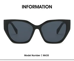 Vue de face de lunettes de soleil tendance à monture polygonale noire et verres gris