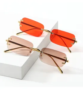Detail of metal hinge with diamond pattern on rimless rectangular sunglasses