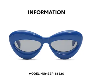 Dettaglio degli occhiali da sole cat-eye blu acceso con lenti grigie, modello n. 86320