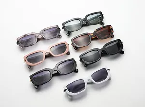 Flat lay of retro rectangular sunglasses in various colors like tortoiseshell and marble