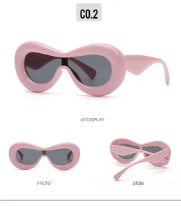 Detailed views of pink chunky frame sunglasses with dark grey lenses and 45 degree display