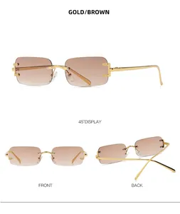 Detail view of gold metal temples and brown gradient lenses on rimless sunglasses