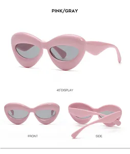 Viste dettagliate degli occhiali da sole cat-eye rosa con lenti grigie da varie angolazioni