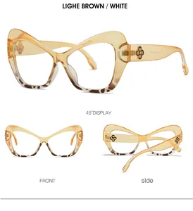 Detalle de gafas de sol mariposa en marrón claro con adornos decorativos de pétalos