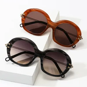 Retro oversized round sunglasses with marble texture frames and gold metal accents