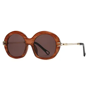 Retro oversized round sunglasses with amber frames and gold metal temples for women