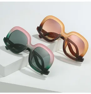 Detailed macro view of trendy irregular wavy gradient frames in green-pink and brown-orange