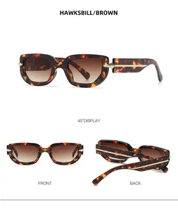 Close-up of hawksbill brown polygonal sunglasses with metallic temple accents